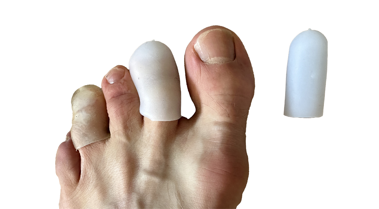 Hjælpe mod smert i fødder under vandring, tåbeskytter, silikone, tå ring af Erik B. Jørgensen